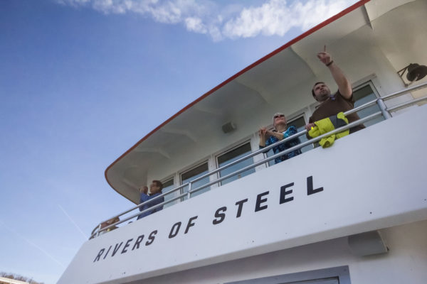 Explorer Upper Deck with guests 1600 x 1000 Guests take photos and use binoculars as the pass Station Square on the Explorer riverboat.