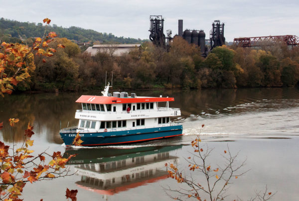 The Explorer Riverboat with the Carrie Blast Furnaces in the background. and early fall leaves.