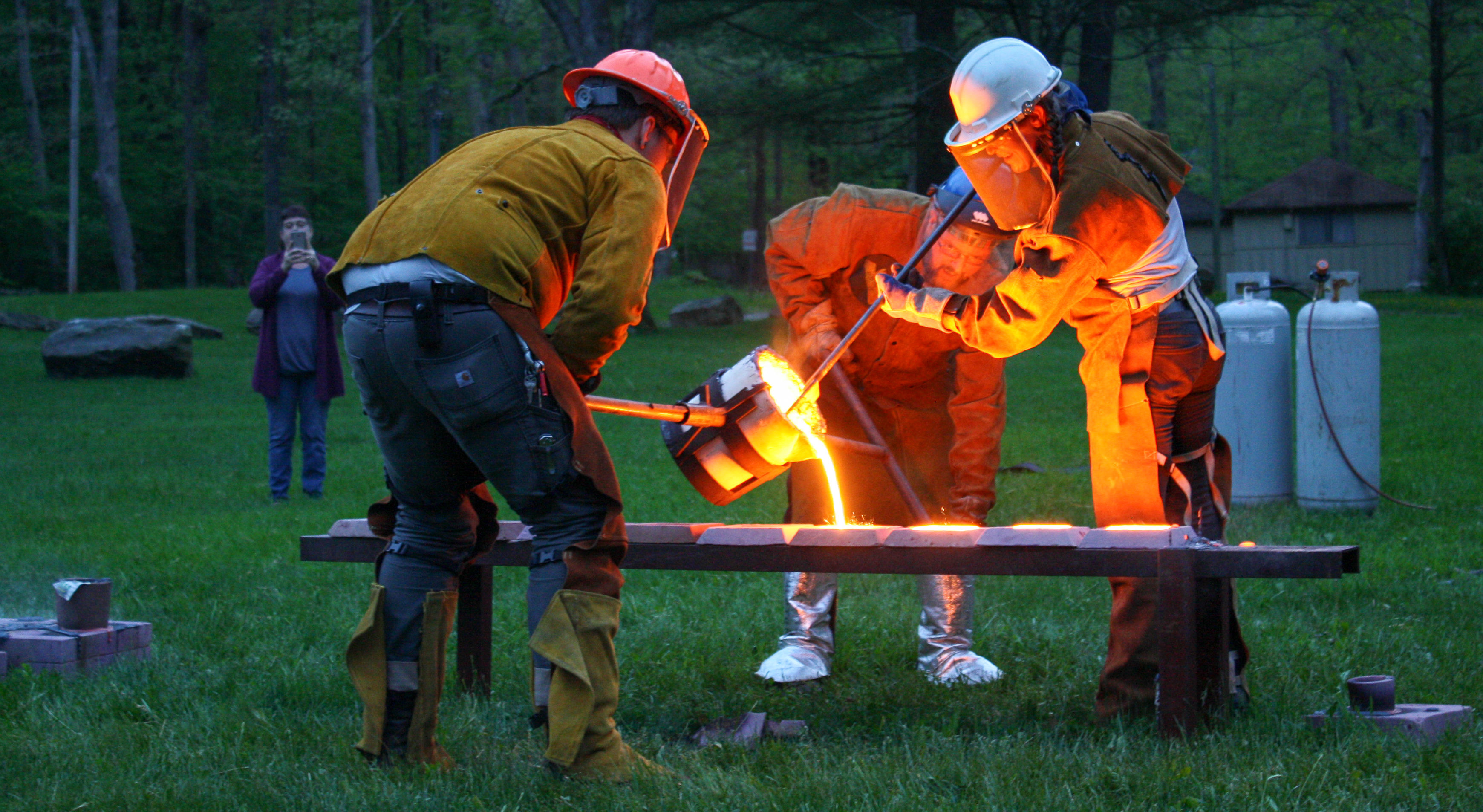 artist pour metal outside at touchstone center for craft campus