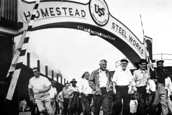 Archival image of workers changing shifts at Homestead Steel Works