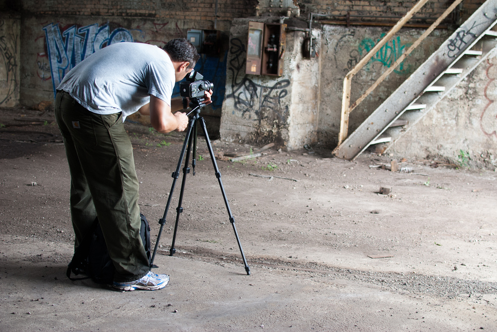 photographer setting up a shot at Carrie furnaces