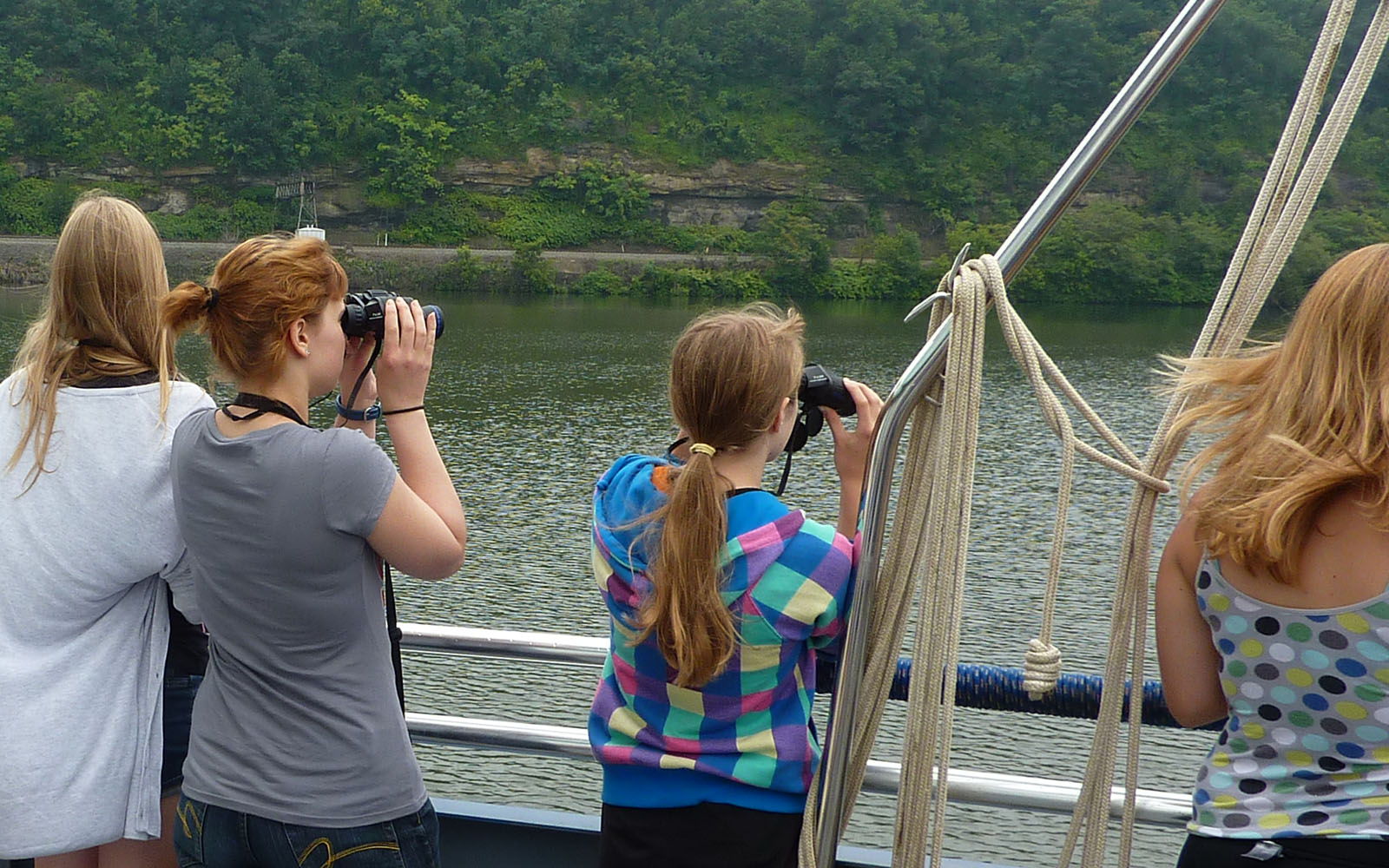 Girls with binoculars bird spotting.