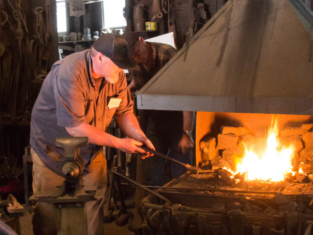 a blacksmith at the forge