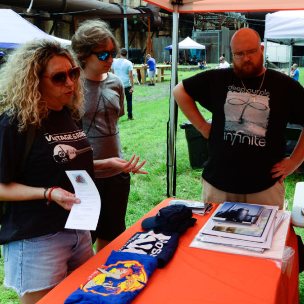 event attendees visit the merchandise tent