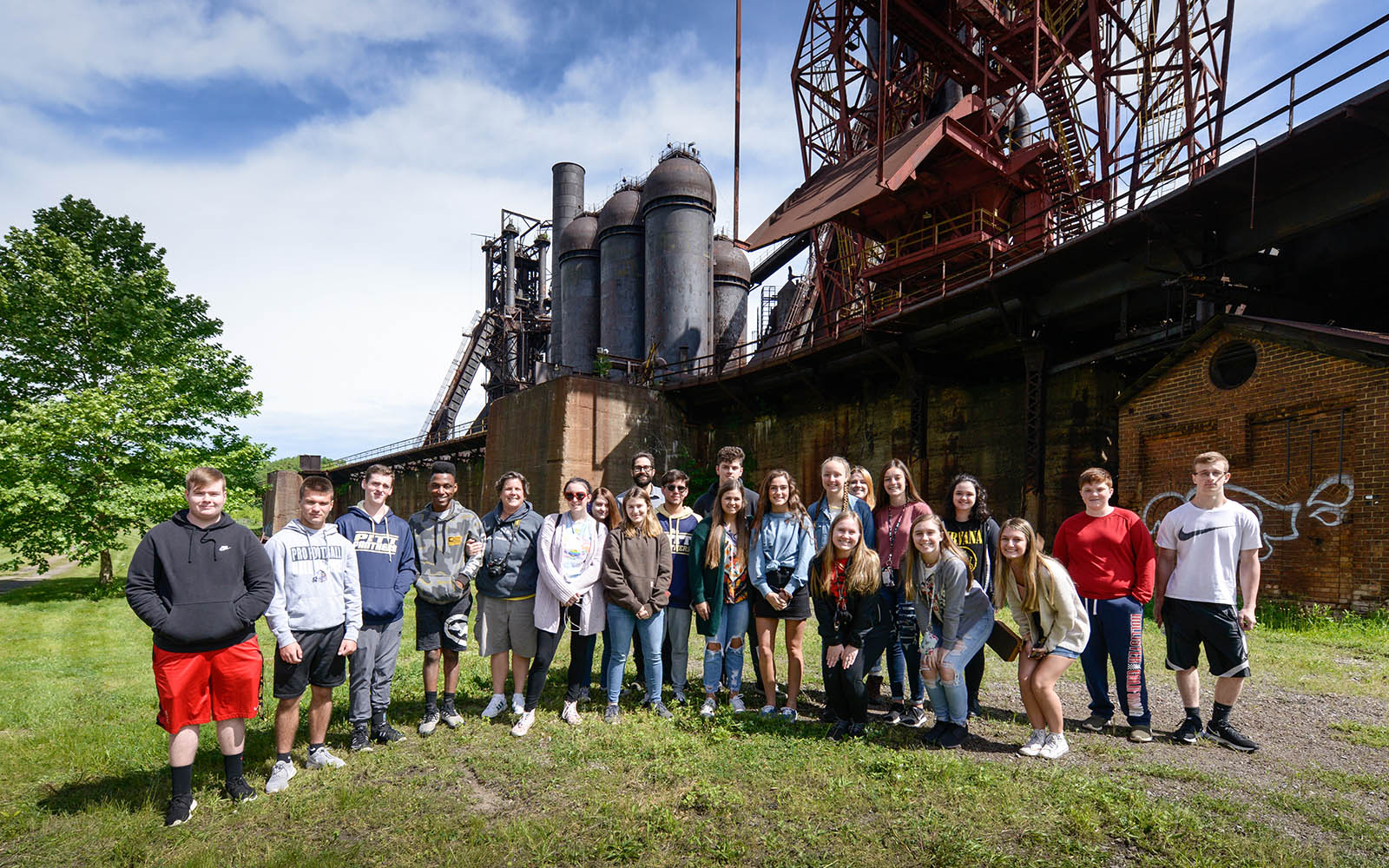 a posed group photo of students in the oreyard