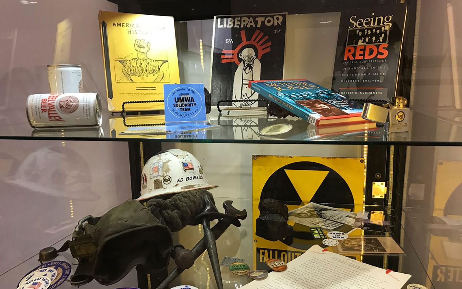 Archival objects on glass shelves