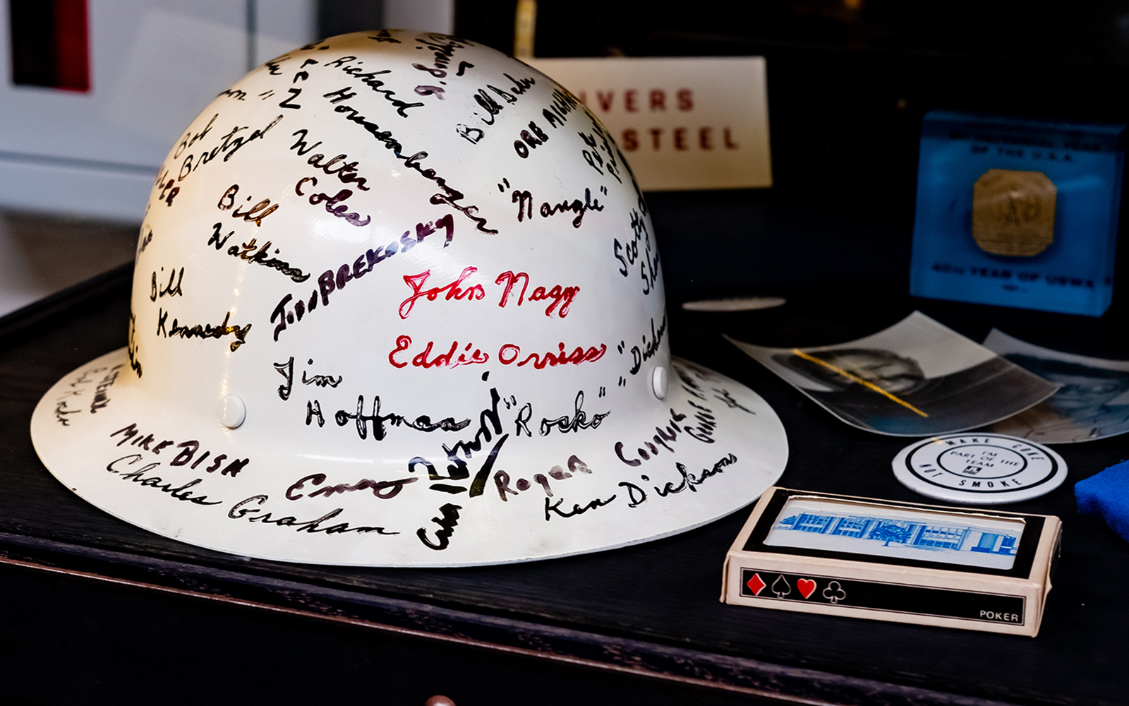 interior of steel case with hard hat and cards