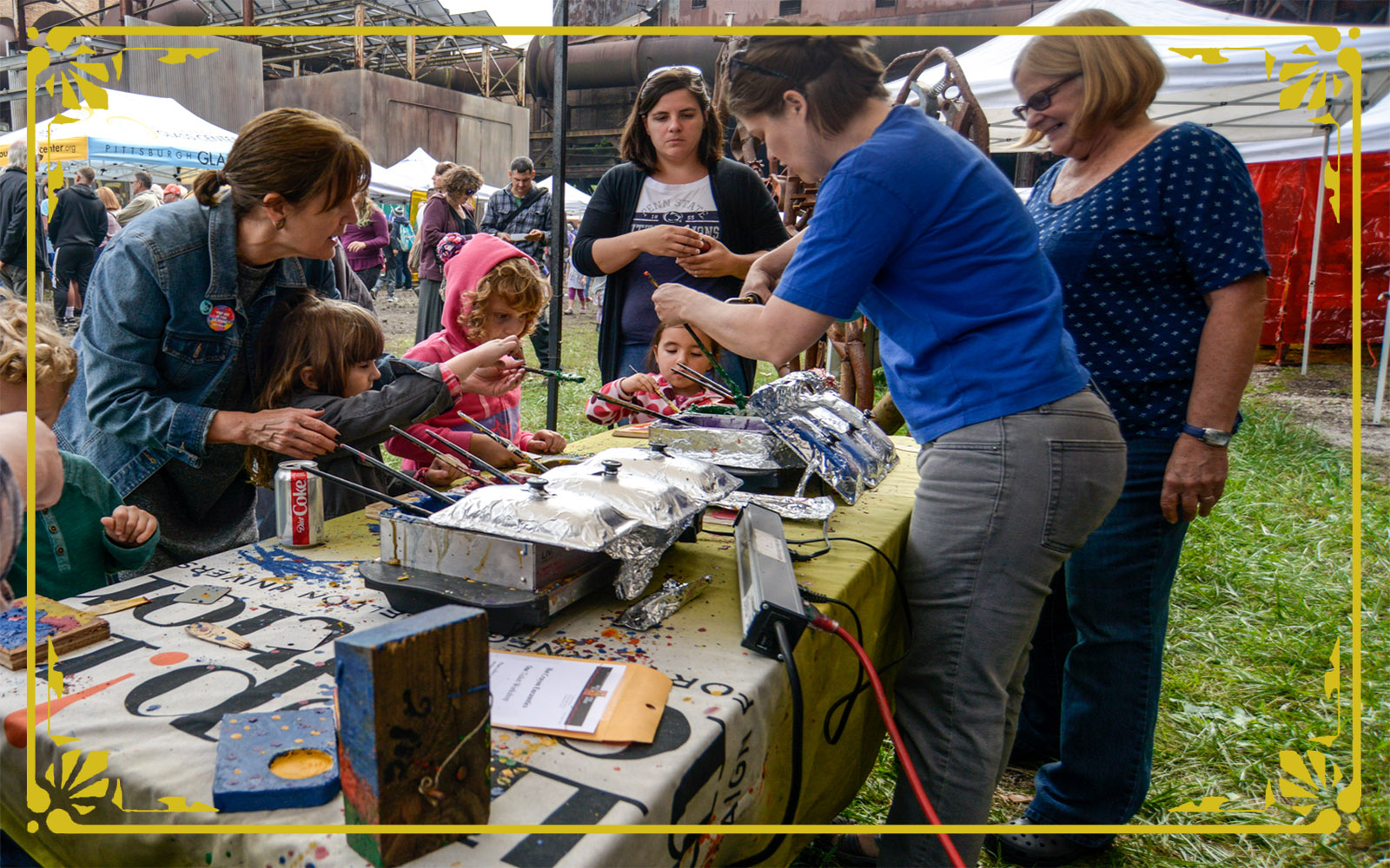 children work on hot crayon encaustics during festival of combustion