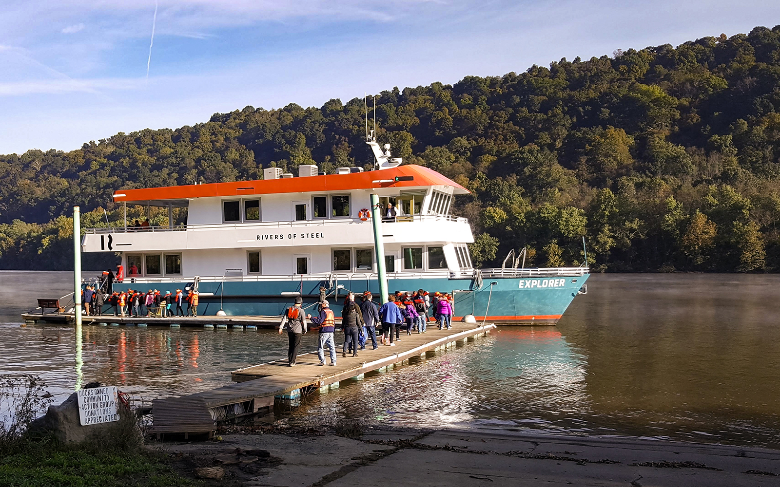 The Explorer riverboat at dock with students entering the boat.