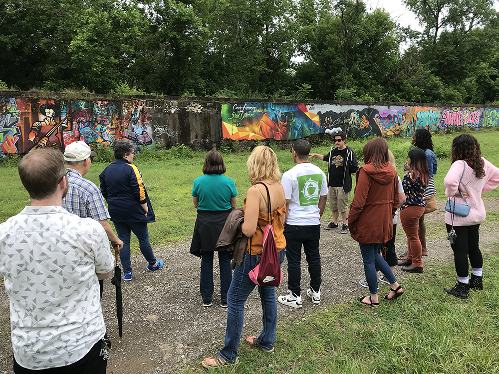 graffiti and style writing workshop participants tour the existing murals on site at the Carrie Furnaces