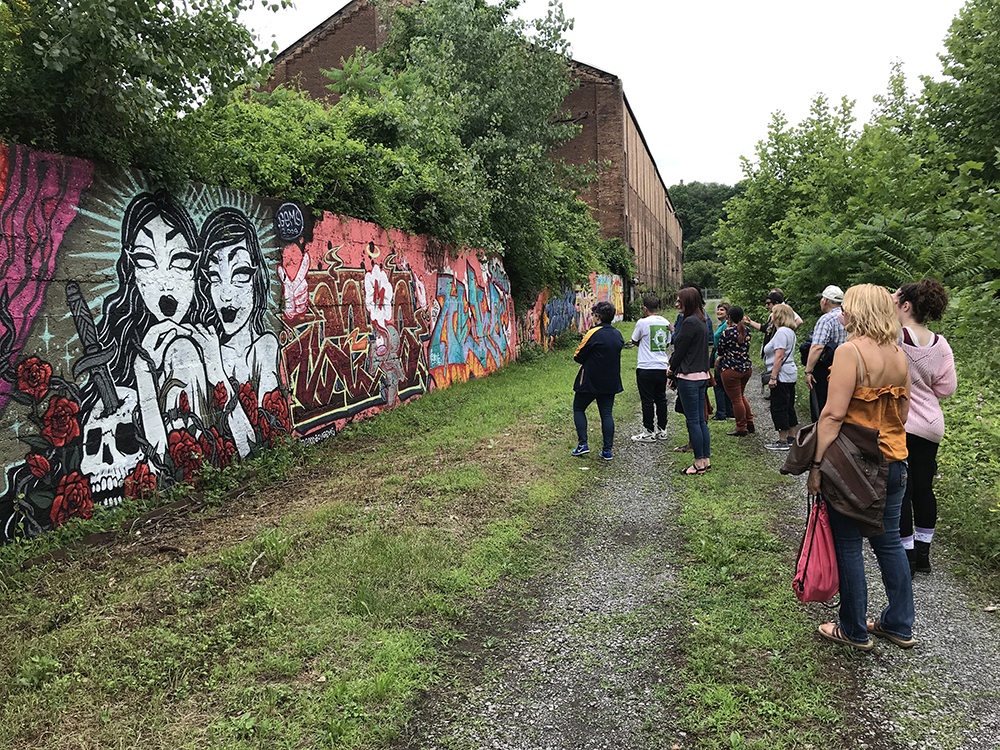 graffiti and style writing workshop participants tour the existing murals on site at the Carrie Furnaces