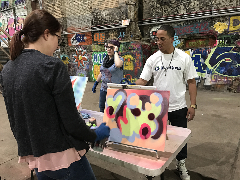 graffiti and style writing workshop participants create their paintings