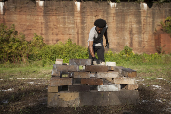IMG_9804 performers stack bricks as part of Amber Niedomys' alloy pittsburgh performance in 2013