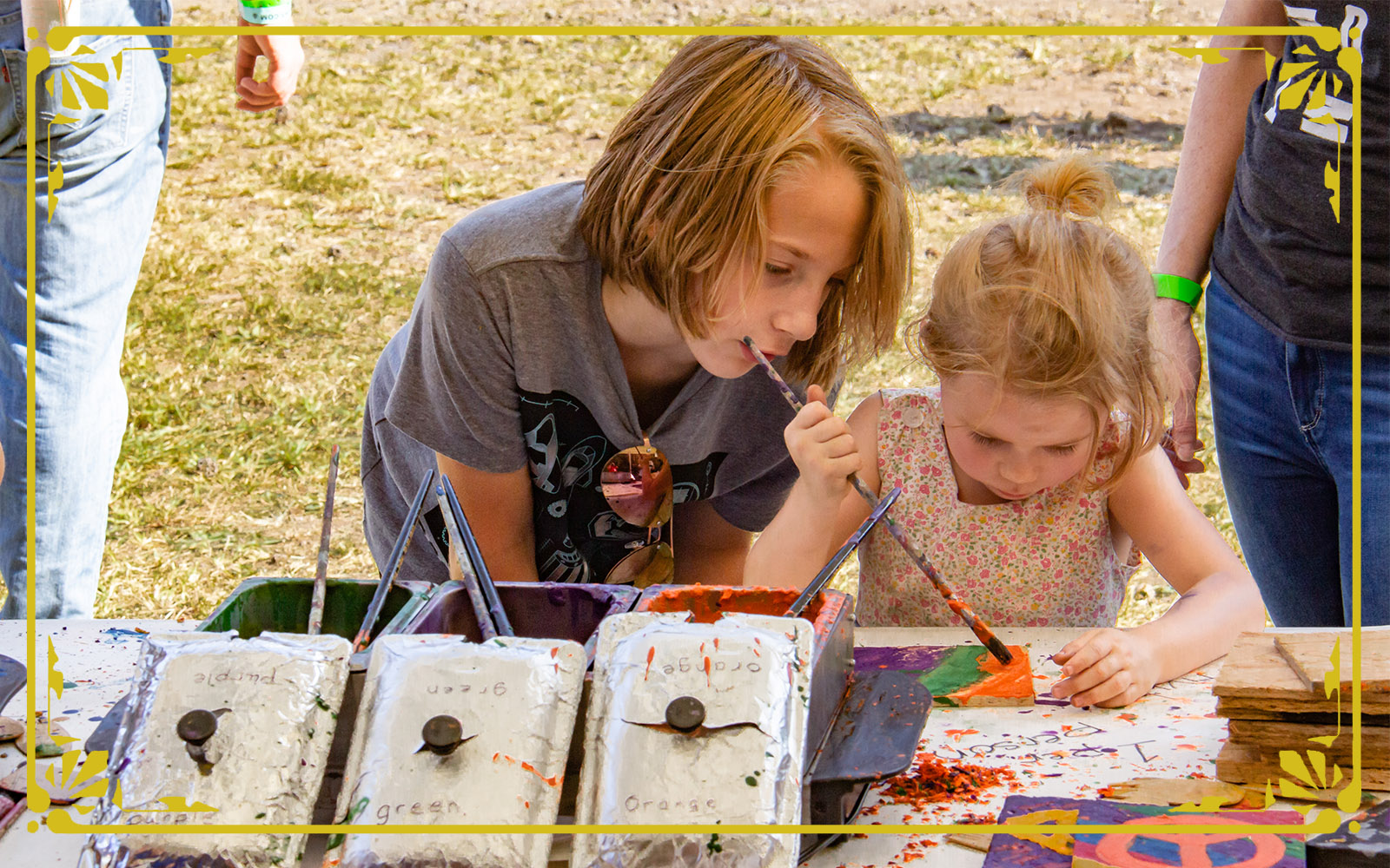 children create a hot crayon encaustic painting during the festival of combustion