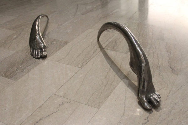 Sculpture entitled Iron Gait - two legless feet walking