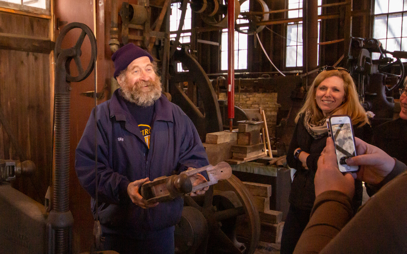 George Blystone shows a wooden mold.