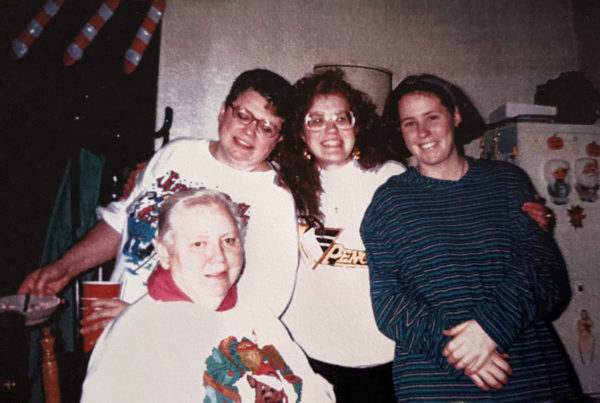 Four women in a room decorated for Christmas, circa early 1990s.