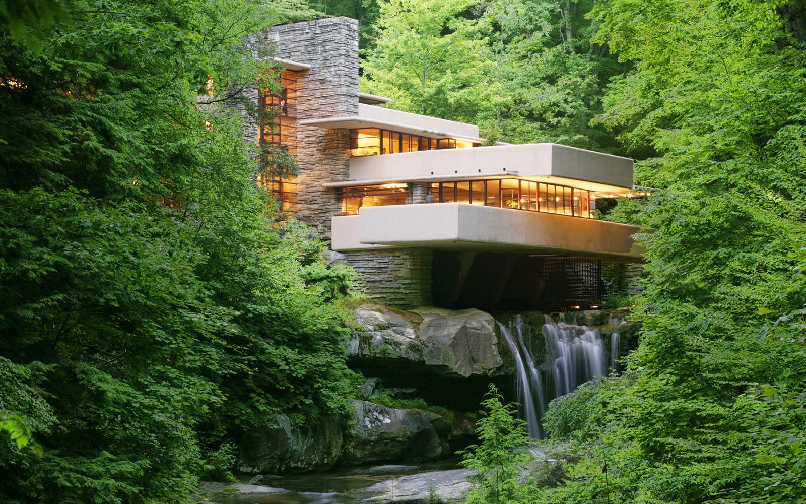a cantilevered home over a stream