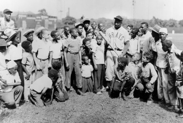 Josh Gibson with a crowd of young ballplayers