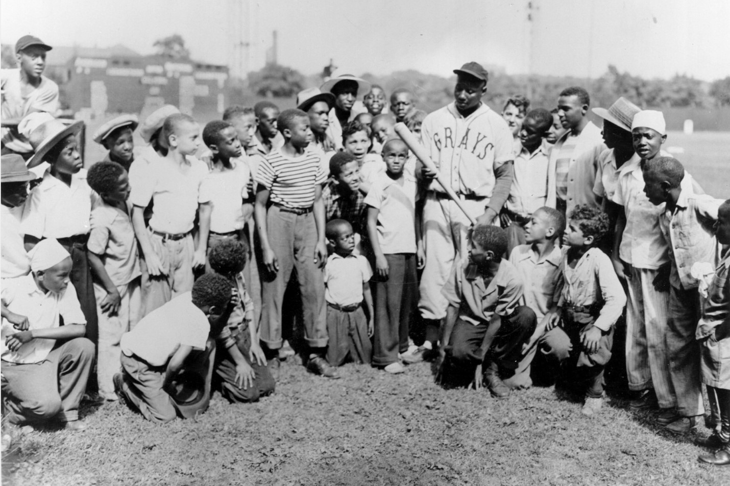 Josh Gibson with a crowd of young ballplayers