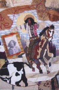 A quilt of a Black cowboy on a horse
