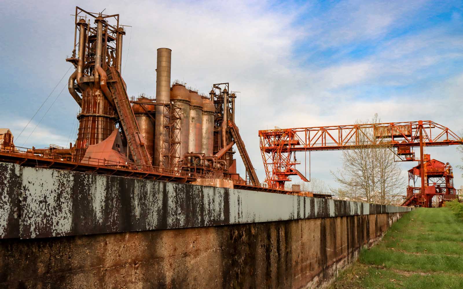 The Carrie Blast Furnaces reflect golden hour light.