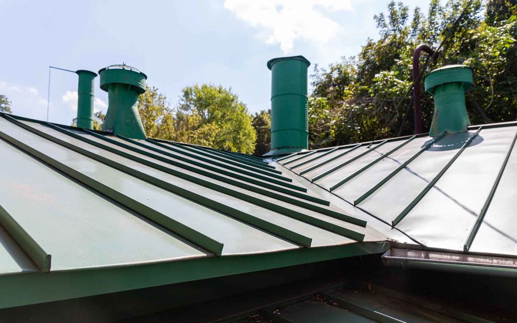 A green standing seam metal roof.