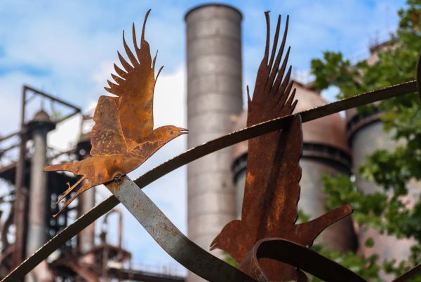 Two recycled metal birds appear on a sculpture in from the the stack from the Carrie Blast Furnaces.