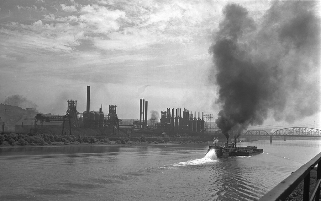 a black and white image of the Carrie Furnaces from across the river.