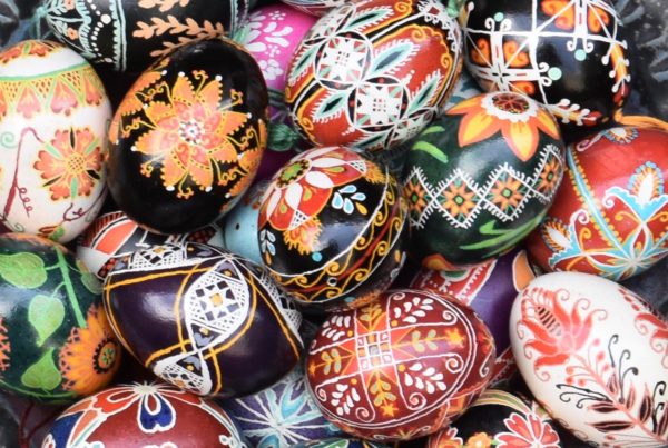 A bowl full of decorated pysanky eggs.