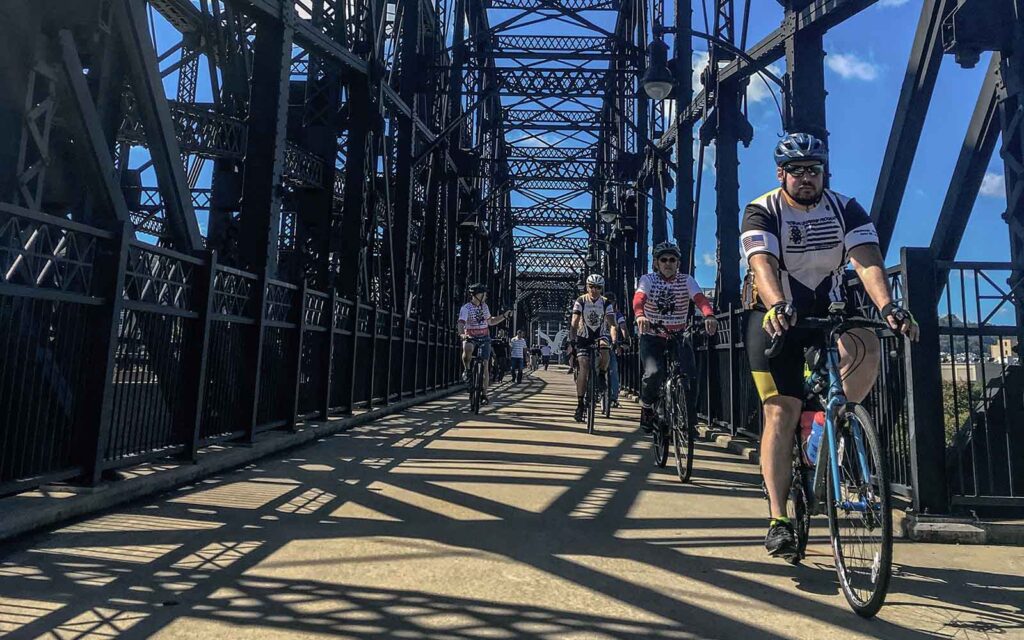 A group of bikers cross the Hot Metal Bridge in Pittsburgh