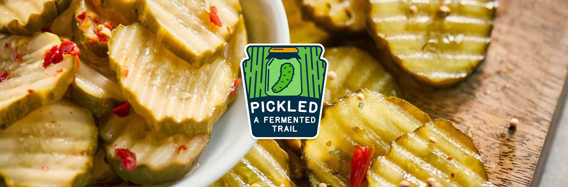 Sliced pickles with a graphic for the trail