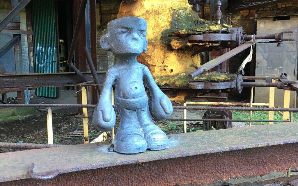 completed sculpture created by Jamie Matthews for industrial grit and graffiti.
