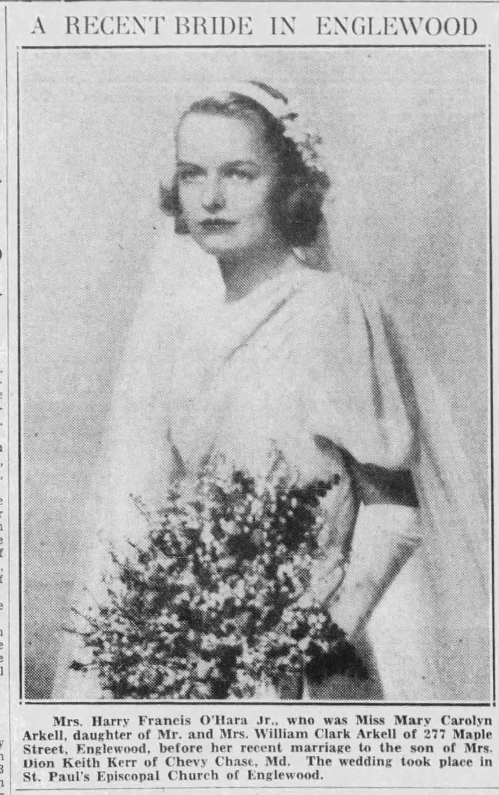 A photograph of a young woman in a wedding dress with clean lines holding a bouquet of flowers.