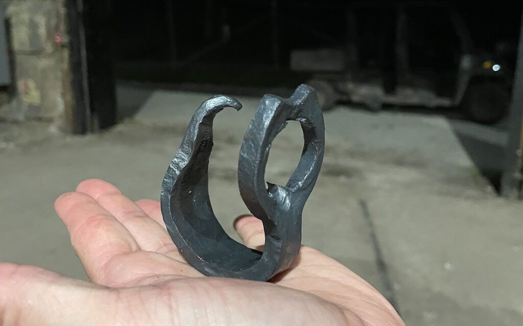 one participant displays their completed bottle opener in their hand