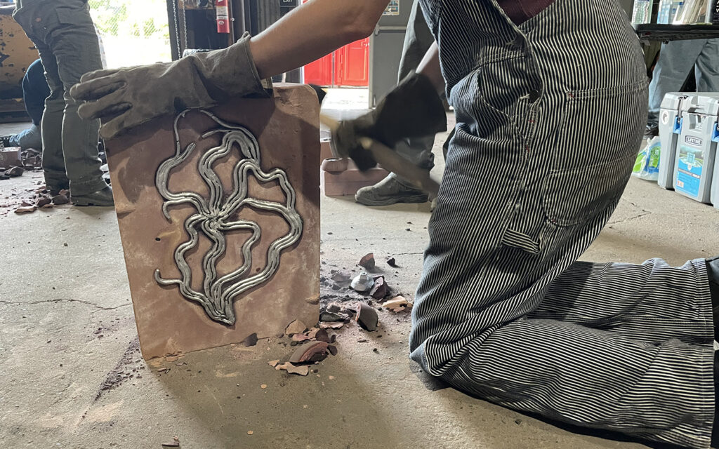 opening the mold after casting is completed