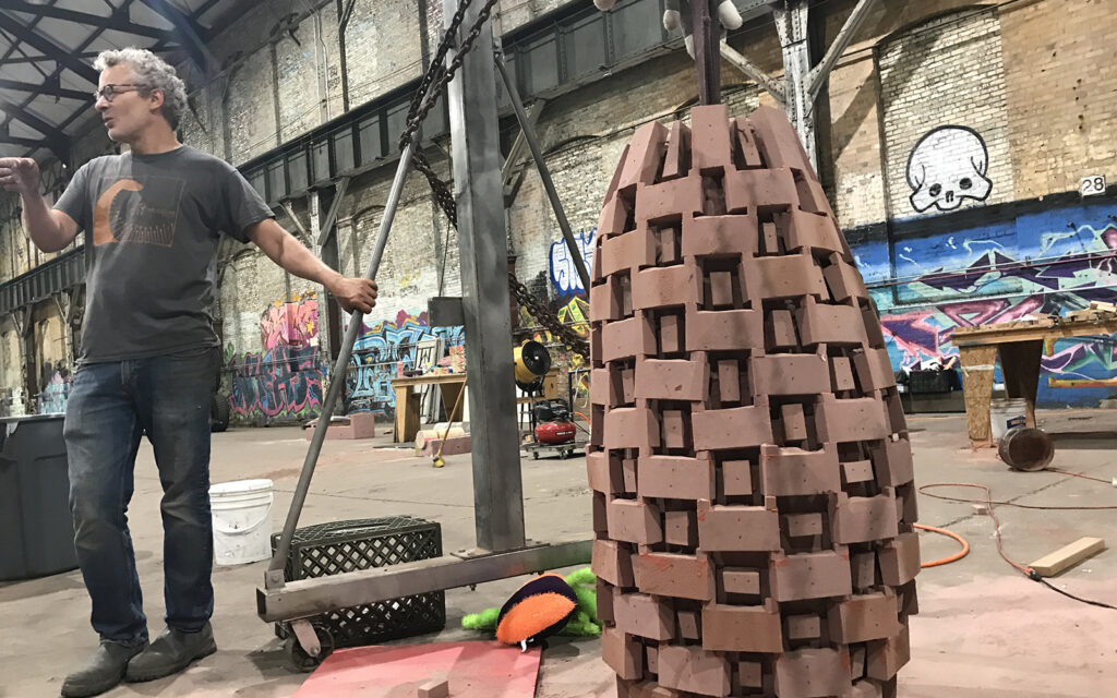 A large complex sand mold being prepared for casting