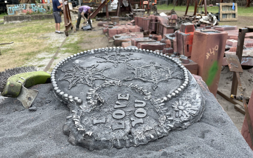 close up image of a cast in iron design created during an intro to iron casting workshop
