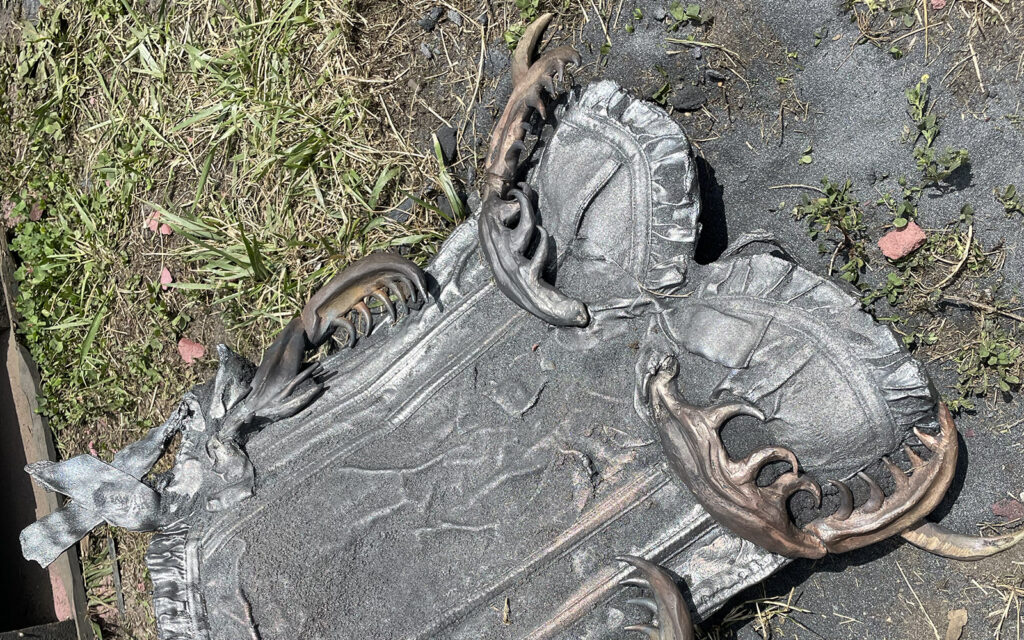 close up image of a corset cast in iron during an intro to iron casting workshop