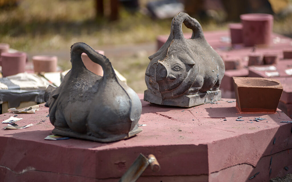 cast iron pigs used as mold weights during weeklong iron intensive workshops.