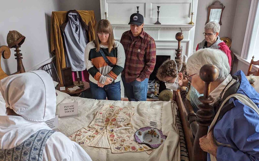 Patrons tour a historic home.