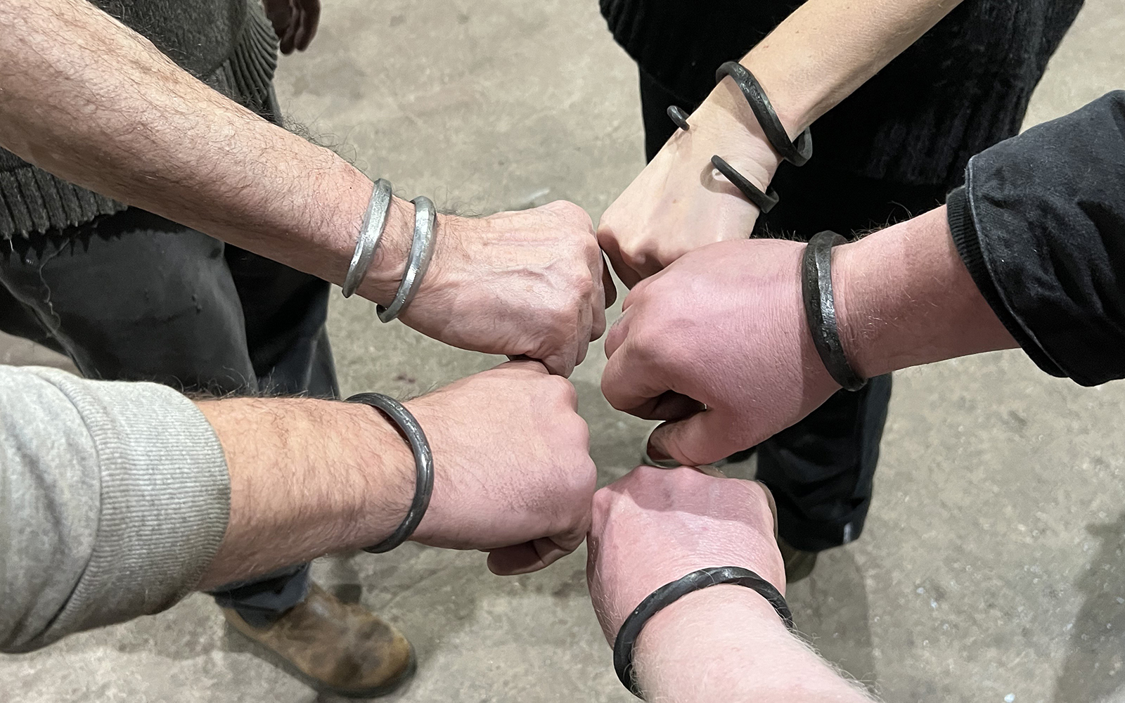 participants display their completed cuffs