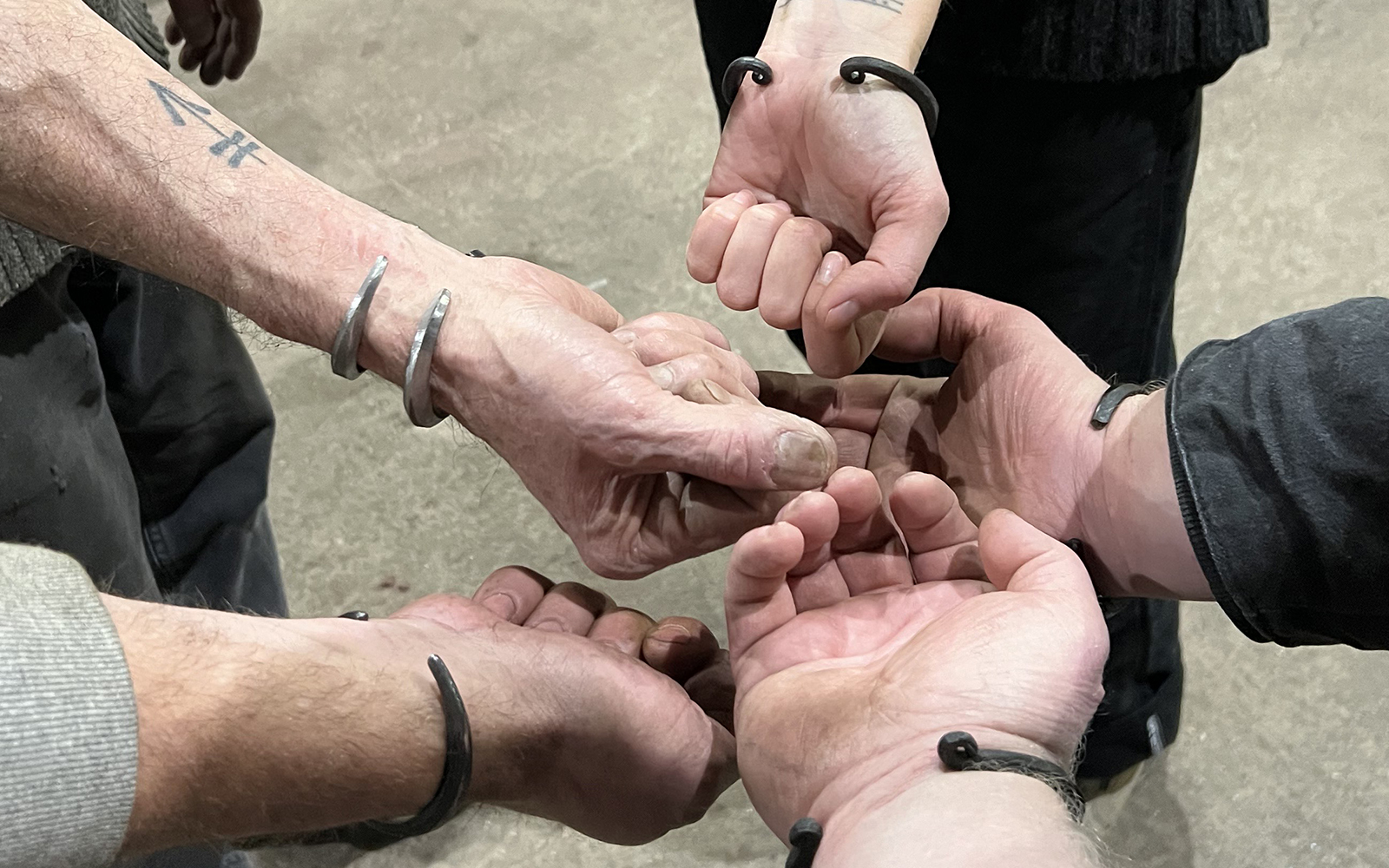 participants display their completed cuffs