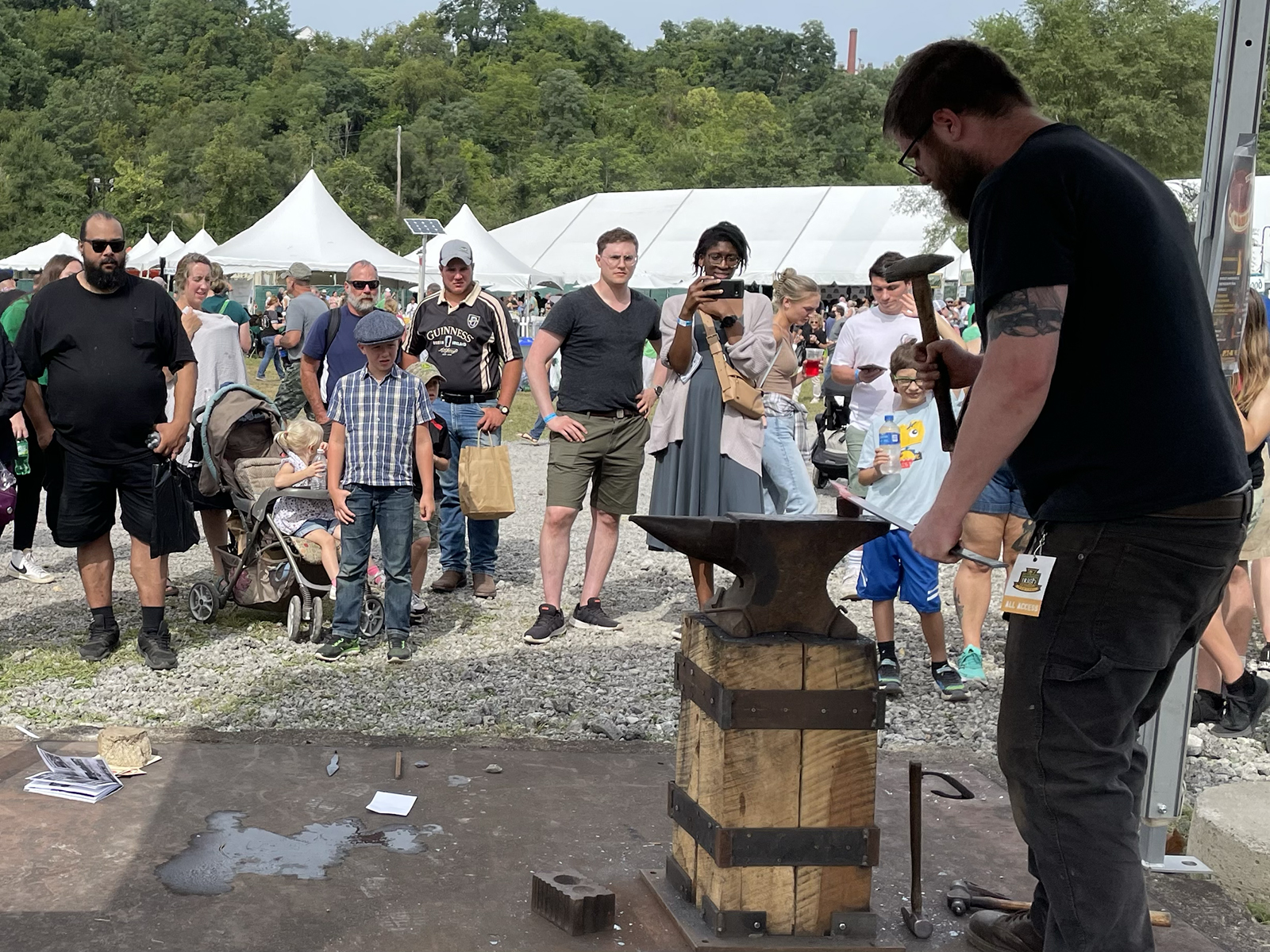 A blacksmithing demonstration taking place at the Festival of Combustion.